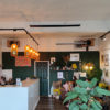 Herschel Black summit in coffee shop and plant shop 1200 x 700