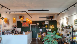 Herschel Black summit in coffee shop and plant shop 1200 x 700