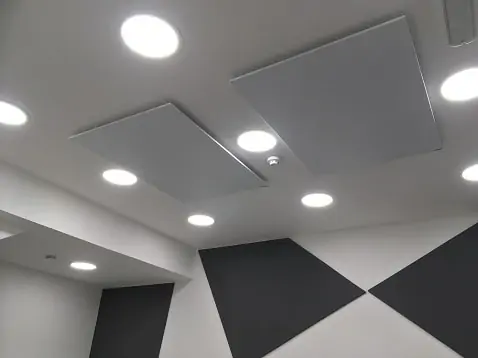 Herschel white panels ceiling mounted in office space