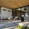 Herschel Rio glass electric patio heater in covered patio seating area