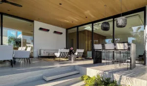 Herschel Rio glass electric patio heater in covered patio seating area