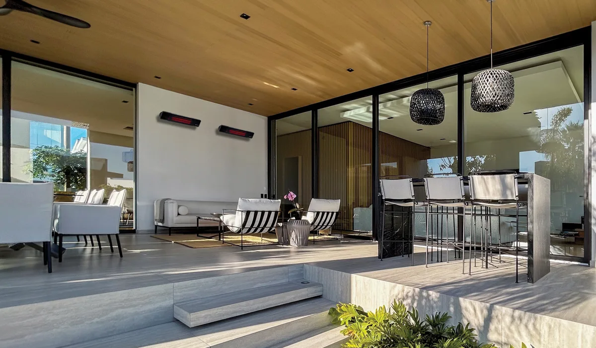 Herschel Rio glass electric patio heater in covered patio seating area