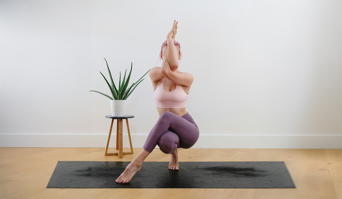 Woman doing yoga pose in studio